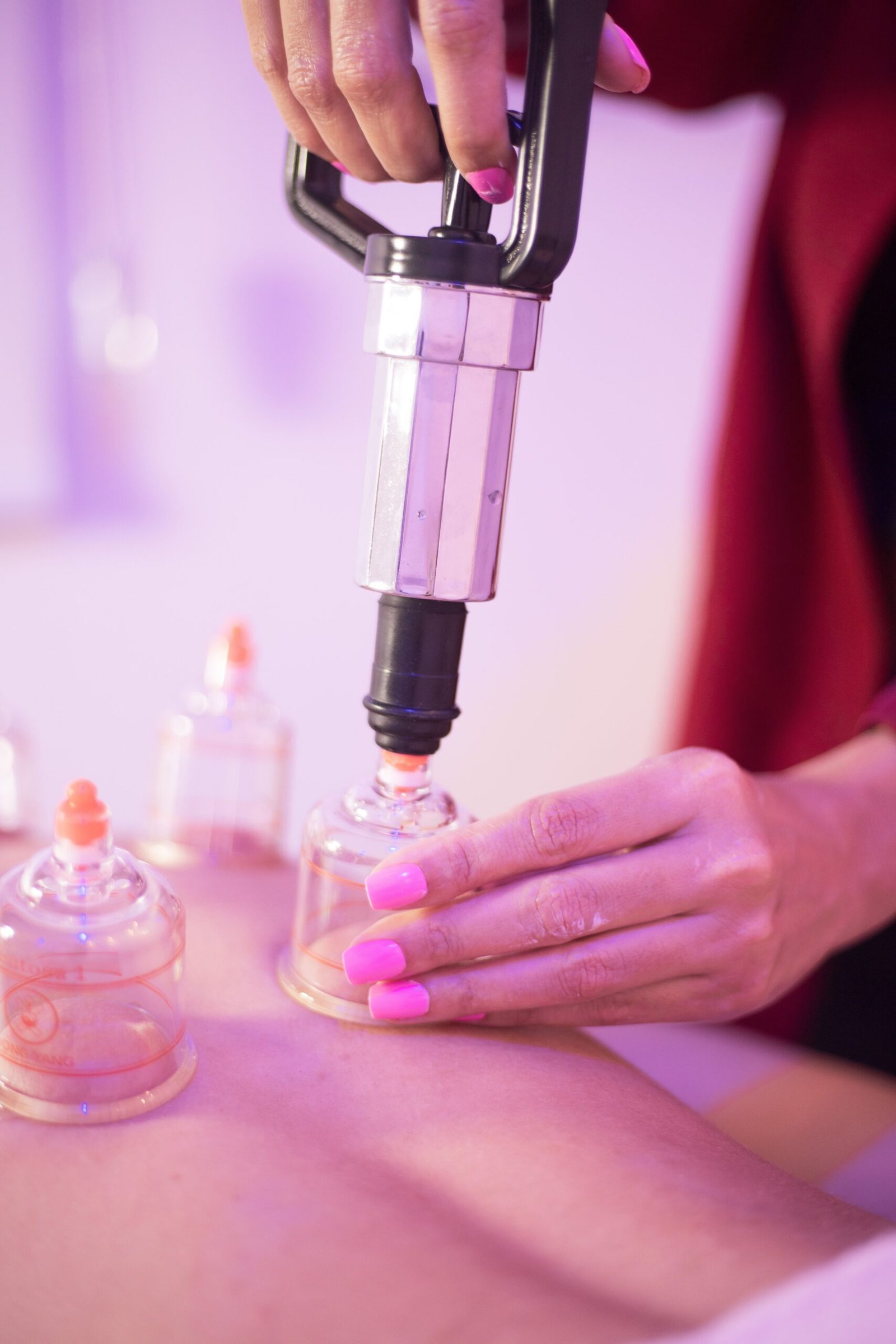 Cupping therapy practitioner preparing equipment