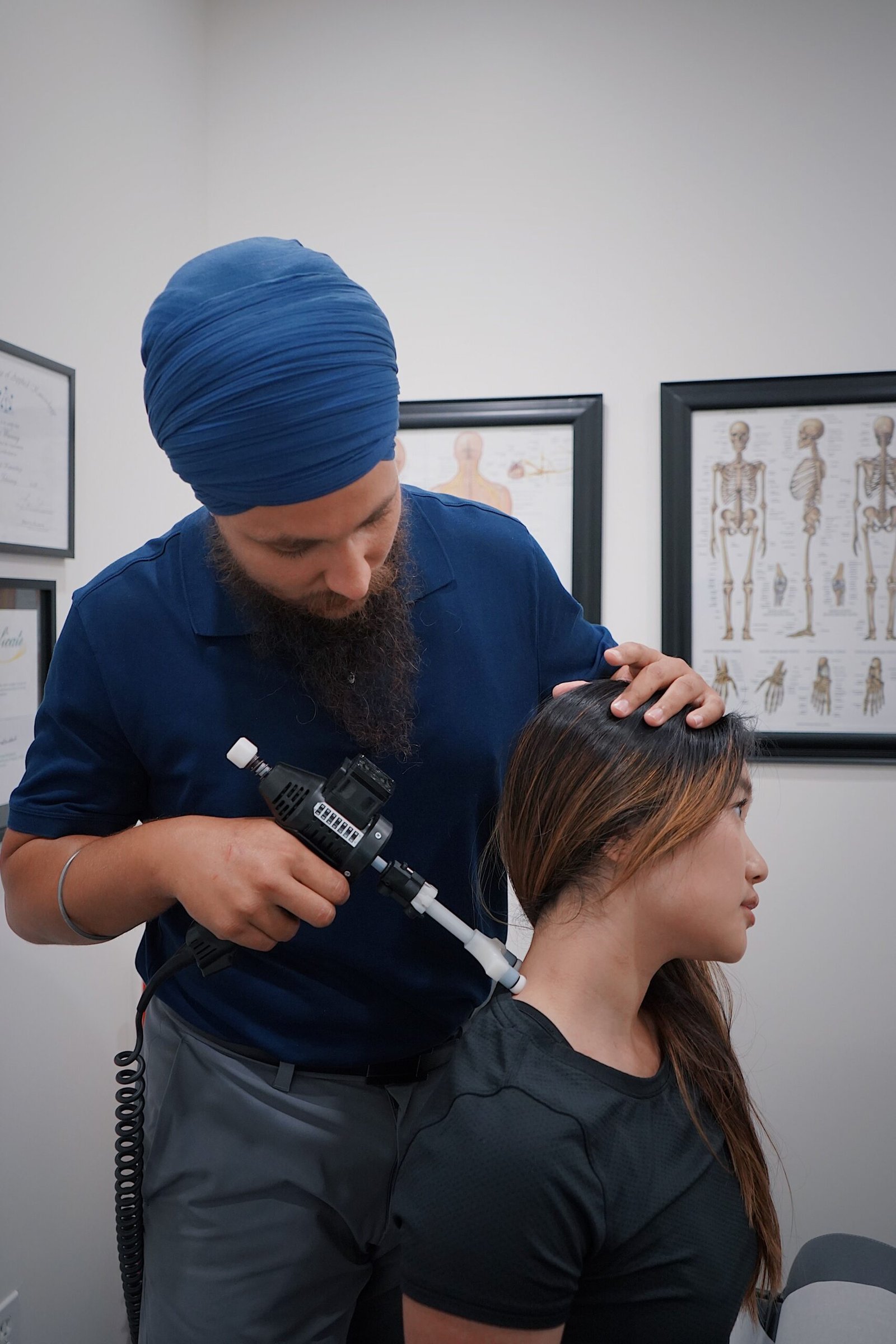 Chiropractor examining a patient